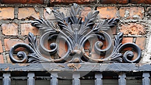 A closeup of the handcrafted ironwork on the buildings gates showcasing the level of detail and skill that went into photo
