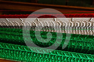 Closeup on handmade hammock with Mexican Flag colors photo