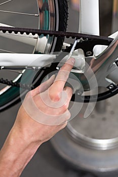 Closeup of the hands of bicycle mechanic at work