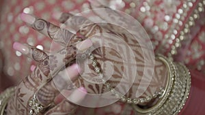 Closeup of hands Indian Bride getting ready for her traditional Indian Wedding