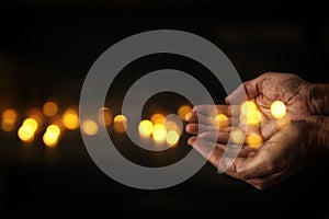 closeup hands of man begging for help. concept for poverty or hunger, seeking for light in the dark.