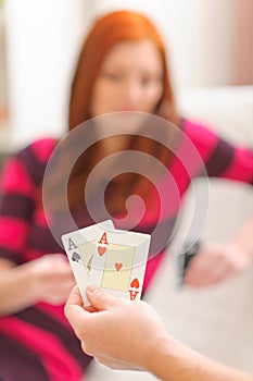 Closeup on hands with playing cards