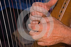 Closeup Hands Playing Harp