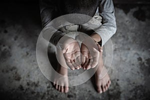 Closeup hands poor child begging you for help concept for poverty  people, Human Rights
