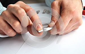 Closeup of hands removing shield from the single professional coaxial cable connector.