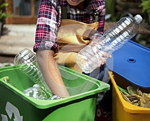 Closeup of hands separating plastic bottles