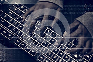 Closeup of hands working on computer keyboard