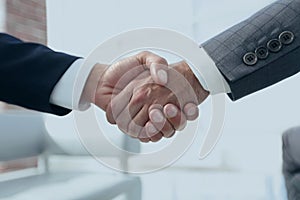 Closeup.handshake of business partners