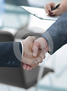 Closeup.handshake of business people