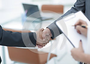 Closeup.handshake of business people