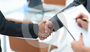 Closeup.handshake of business people