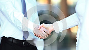 Closeup .the handshake of a businessman and business woman.