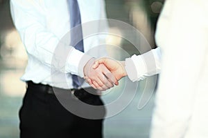 Closeup .the handshake of a businessman and business woman.