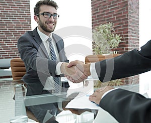 Closeup. handshake between the financial Manager and the client