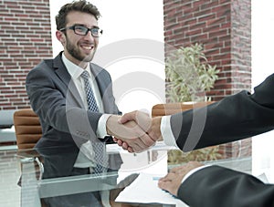 Closeup. handshake between the financial Manager and the client