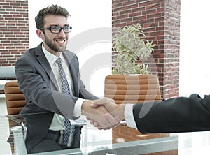 Closeup. handshake between the financial Manager and the client