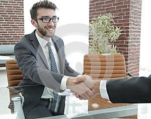 Closeup. handshake between the financial Manager and the client