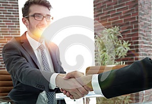 Closeup. handshake between the financial Manager and the client