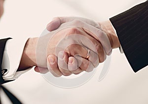 Closeup handshake proven business partners