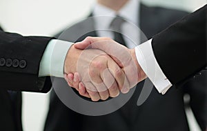 Closeup handshake proven business partners