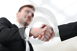 Closeup handshake proven business partners