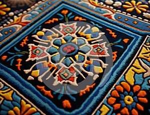 A closeup of a handwoven rug showing the detailed and intricate patterns that were used in traditional art. Lifestyle