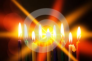 Closeup of Hanukkah menorah, or hanukkiah for Jewish holiday Hanukkah. Nine colored candles.