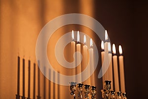 Closeup of Hanukkah menorah, or hanukkiah in the light of the sun at sunset for Jewish holiday Hanukkah.