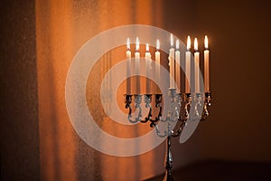 Closeup of Hanukkah menorah, or hanukkiah in the light of the sun at sunset for Jewish holiday Hanukkah.