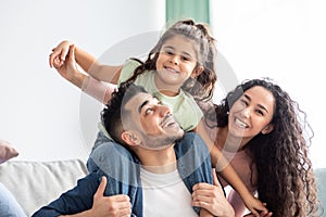 Closeup Of Happy Arab Family Of Three Having Fun Together At Home