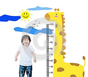 Closeup happy asian kid stand for measure height with cute cartoon isolated on white background