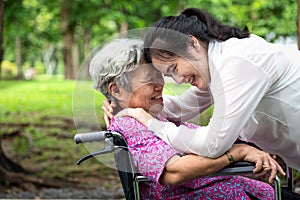 Closeup,Happy beautiful asian senior people with adult woman hugging,smiling in summer,love of mother with her daughter in photo