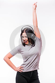 Closeup of happy brunet caucasian girl listen dancing to music with headphones