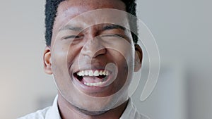 Closeup of a happy business man laughing at a funny joke, being carefree and having fun at work alone. Portrait of the