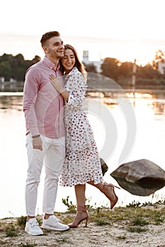 Closeup of happy loving couple spending leisure time together at beach. couple in love by the water. warm summer day