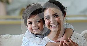 Closeup happy young Indian woman and little son family portrait