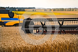 Closeup of harvesting machinery detail while working the field