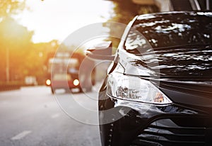 Closeup headlights of black car.