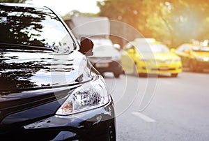 Closeup headlights of black car.