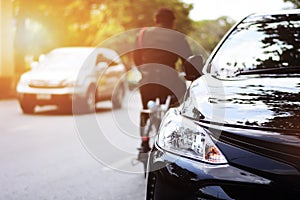 Closeup headlights of black car.