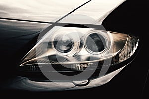 Closeup headlights of car.