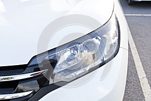 Closeup headlights of car.