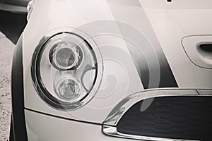 Closeup headlights of car.