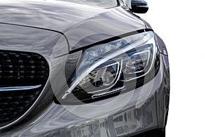 Closeup headlights of car and Car exterior detail with White back