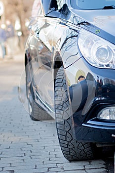 Closeup headlights of car on the street