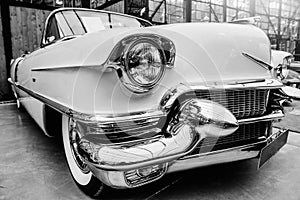 Closeup of the headlights and front bumper on vintage automobile