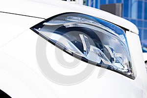 Closeup headlights of luxury car.