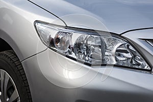 Closeup headlights . Modern car. Concept of expensive auto
