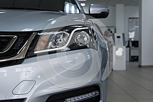 Closeup headlights of a modern car. Detail on the front light of a car