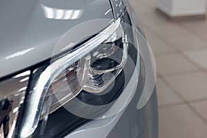 Closeup headlights of a modern car. Detail on the front light of a car.